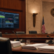 Federal prediction market regulation hearing room with neutral event-contract graphics