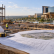 Editorial illustration of an Oklahoma tribal casino expansion, construction plans, and a casino resort