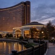 Editorial illustration for Encore Boston Harbor Revenue Falls as Casino Strike Continues